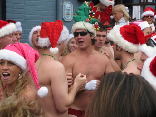 Speedo clad Santas party outside Federal House in Annapolis