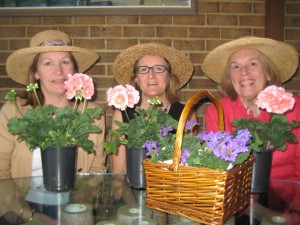 From left, Four River Garden Club members Charlotte Pennington, Kim Morrow and Lisa Sherwood prepare annual as well as perennial pottings for the club’s annual Flower Mart which will begin at 8:30 a.m. Tuesday, April 30, at the Market House in downtown Annapolis.  A tradition for 65 years, the mart offers native plants and perennials from members’ gardens, herbs, hanging baskets and cut flowers.   Club members will fashion May baskets from cut flowers and, for the first time, offer expert advice on flower arrangement for the novice gardener.   Arranging workshops are scheduled for 9 a.m. and 10 a.m. for fees of $25 to $35. Call 410.757.5867 to register. Flower mart proceeds support community gardening projects as well as local historic houses and gardens. 